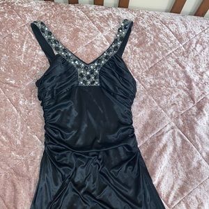 Black stretchy silk mermaid dress. Silver embroidery along a V line chest cutout